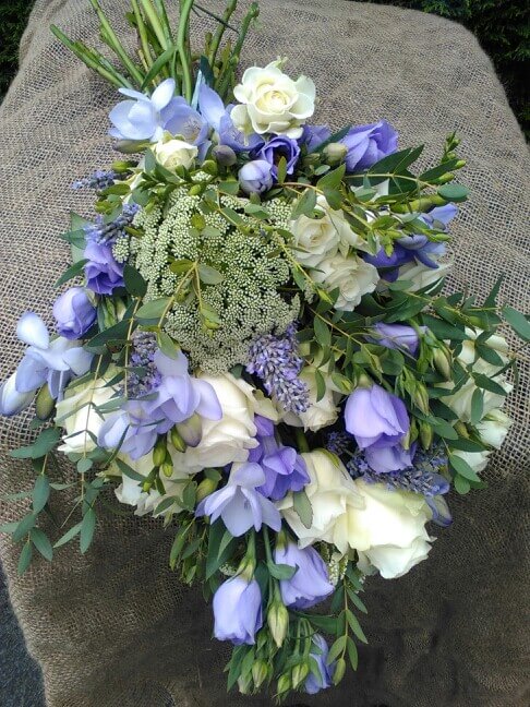 Purple and cream waterfall bridal bouquet